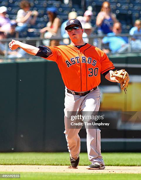 Matt Dominguez of the Houston Astros throws to first base during the 6th inning of the game against the Kansas City Royals at Kauffman Stadium on May...