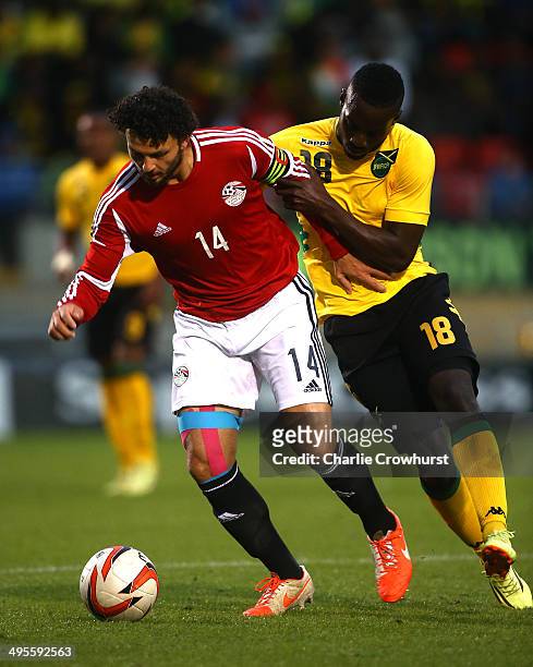 Hossam Ghaly of Egypt looks to hold of Simon Dawkins of Jamacia during the International Friendly match between Jamacia and Egypt at The Matchroom...