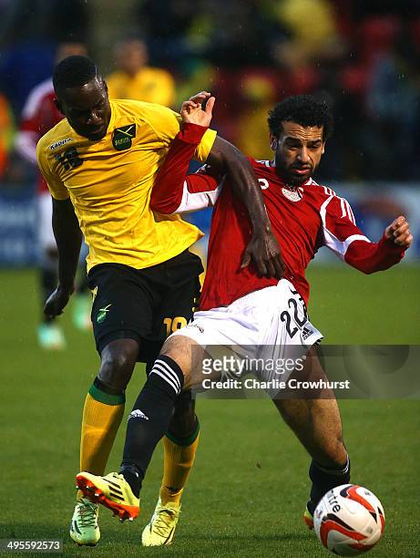 Mohamed Salah of Egypt looks to hold off Jamacia's Simon Dawkins during the International Friendly match between Jamacia and Egypt at The Matchroom...