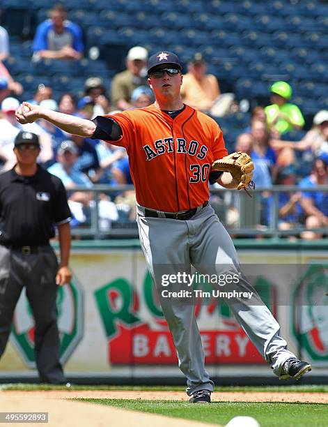 Matt Dominguez of the Houston Astros throws to first base during the 3rd inning of the game against the Kansas City Royals at Kauffman Stadium on May...