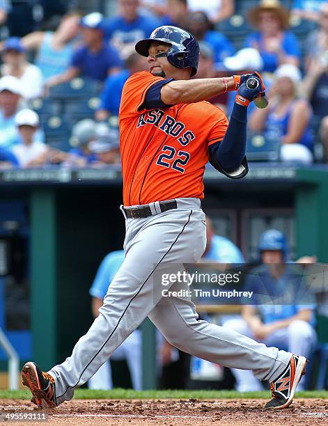 Carlos Corporan of the Houston Astros hits a single during the 2nd inning of the game against the Kansas City Royals at Kauffman Stadium on May 28,...