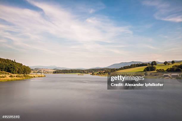 view of lake "drachensee" in rural countryside. - フルトイムヴァルト ストックフォトと画像