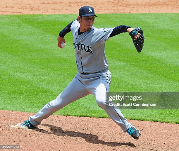 Hisashi Iwakuma of the Seattle Mariners throws a 6th inning pitch against the Atlanta Braves at Turner Field on June 4, 2014 in Atlanta, Georgia.