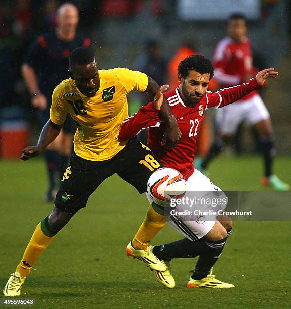 Mohamed Salah of Egypt looks to hold off Jamacia's Simon Dawkins during the International Friendly match between Jamacia and Egypt at The Matchroom...