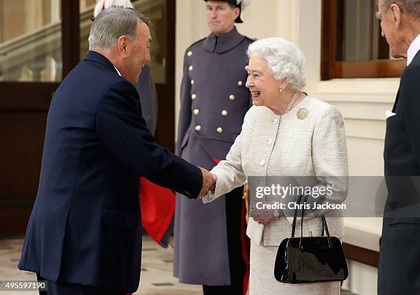 Queen Elizabeth II greets President of the Republic of Kazakhstan Nursultan Nazarbayeva at Buckingham Palace on November 4, 2015 in London, England....