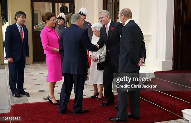 Queen Elizabeth II accompanied by Prince Philip, Duke of Edinburgh and Prince Andrew, Duke of York receives the President of the Republic of...