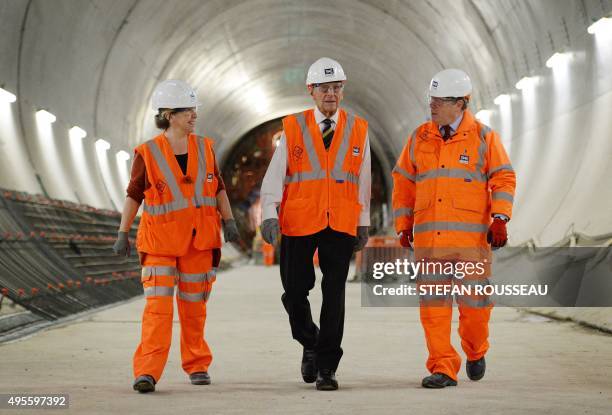 Britain's Prince Philip , Duke of Edinburgh, Crossrail Chief Executive Andrew Wolstenholme and Project Manager Linda Miller are pictured in a tunnel...