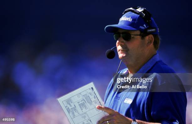 Head coach Mike Holmgren of the Seattle Seahawks looks on with the playbook during the game against the Pittsburgh Steelers at the Three Rivers...