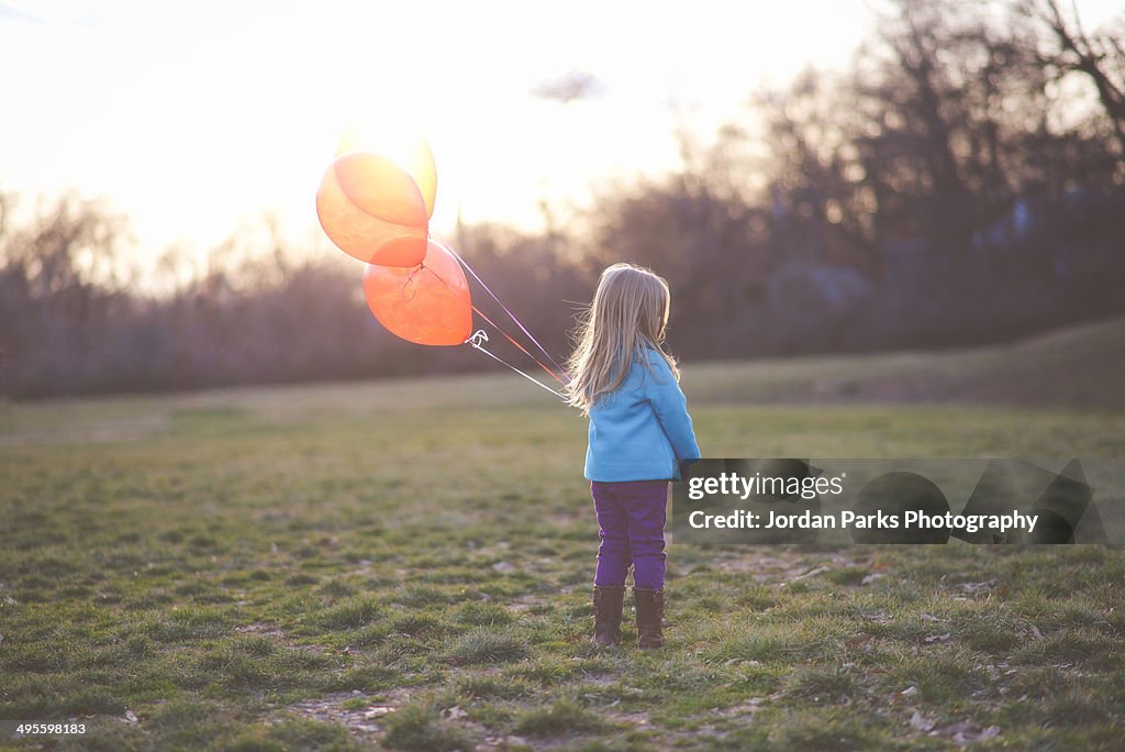 Girl with balloons