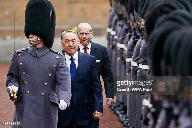 Kazakhstan President Nursultan Nazarbayev and Prince Philip, Duke of Edinburgh review an honour guard at Buckingham Palace on November 4, 2015 in...