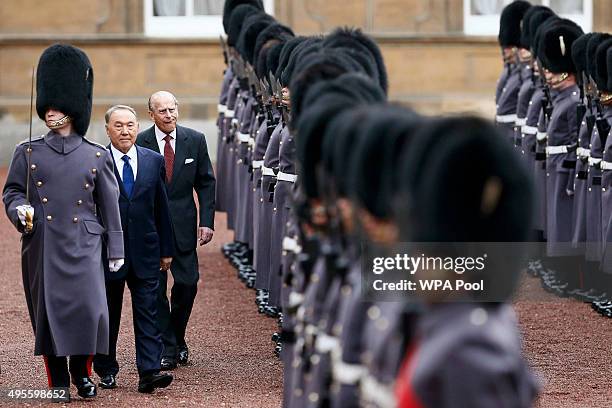 Kazakhstan President Nursultan Nazarbayev and Prince Philip, Duke of Edinburgh review an honour guard at Buckingham Palace on November 4, 2015 in...