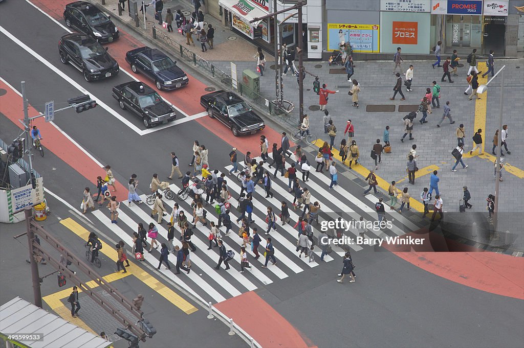 Aerial view of people crossing street