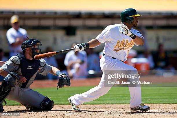 Alberto Callaspo of the Oakland Athletics at bat against the Detroit Tigers during the seventh inning at O.co Coliseum on May 26, 2014 in Oakland,...