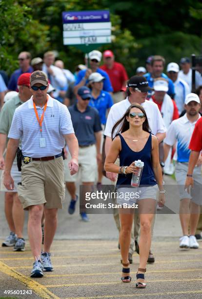 Driver Danica Patrick walks along the second hole following her boyfriend Ricky Stenhouse Jr. Playing in Pro-Am round of the FedEx St. Jude Classic...
