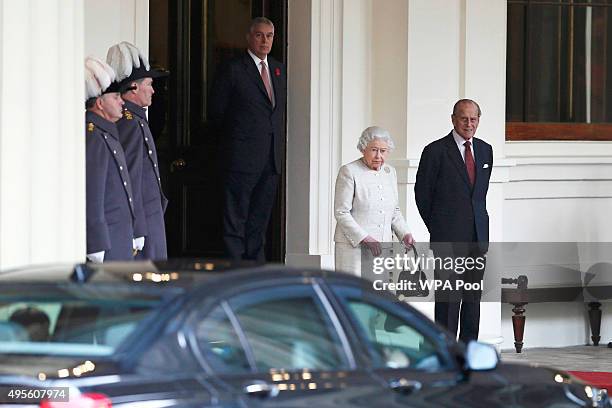 Queen Elizabeth II accompanied by Prince Philip, Duke of Edinburgh wait to greet Kazakhstan's President Nursultan Nazarbayev at Buckingham Palace on...