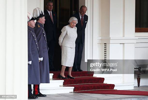 Queen Elizabeth II accompanied by Prince Philip, Duke of Edinburgh wait to greet Kazakhstan's President Nursultan Nazarbayev at Buckingham Palace on...