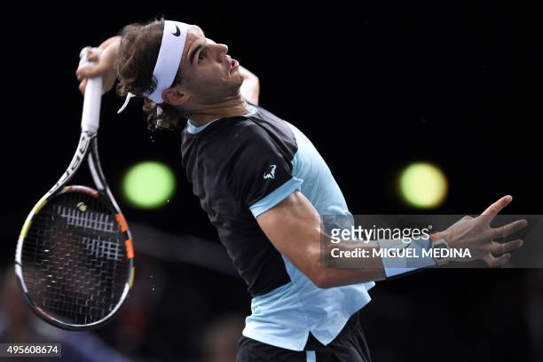 Spain's Rafael Nadal serves the ball to Czech Republic's Lukas Rosol during their second round tennis match at the ATP World Tour Masters 1000 indoor...