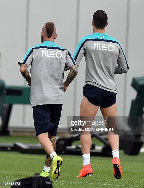 Portugal's Cristiano Ronaldo prepares for some jogging with Raul Meireles during training June 4, 2014 in Florham Park, New Jersey. Portugal made a...