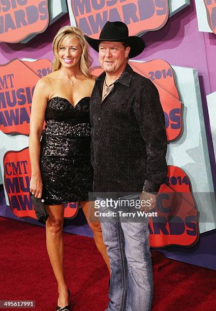 Tracy Lawrence and wife Becca attend the 2014 CMT Music awards at the Bridgestone Arena on June 4, 2014 in Nashville, Tennessee.