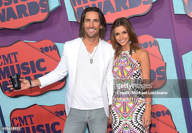 Jake Owen and Lacey Buchanan attend the 2014 CMT Music awards at the Bridgestone Arena on June 4, 2014 in Nashville, Tennessee.