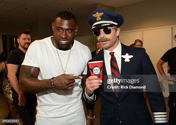 Football player Delanie Walker and Dierks Bentley attend the 2014 CMT Music Awards at Bridgestone Arena on June 4, 2014 in Nashville, Tennessee.