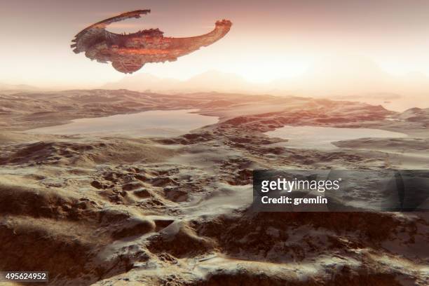 alien spaceship flying over martian landscape with water - alien arrival stock pictures, royalty-free photos & images