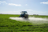 Tractor spray fertilize field pesticide chemical