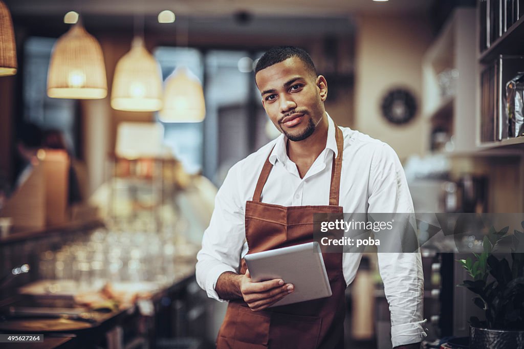 Portrait of Young barista in cafe shop