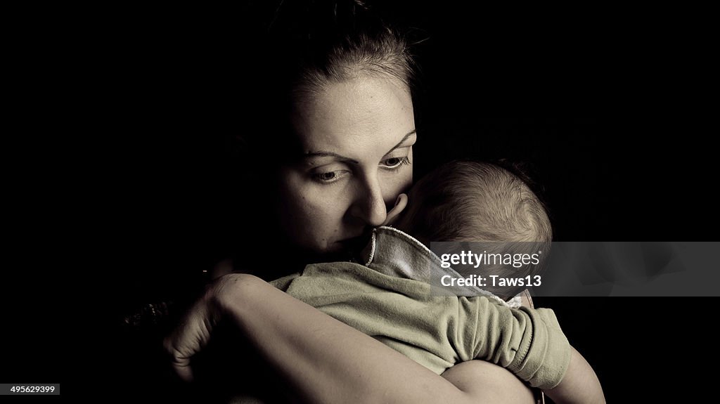 Mother giving love to her child