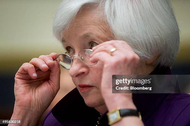 Janet Yellen, chair of the U.S. Federal Reserve, adjusts her glasses during a House Financial Services Committee hearing in Washington, D.C., U.S.,...