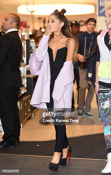 Ariana Grande attends a photocall to support the launch of her debut fragrance, Ari by Ariana Grande and also meet and greet her fans at Boots,...