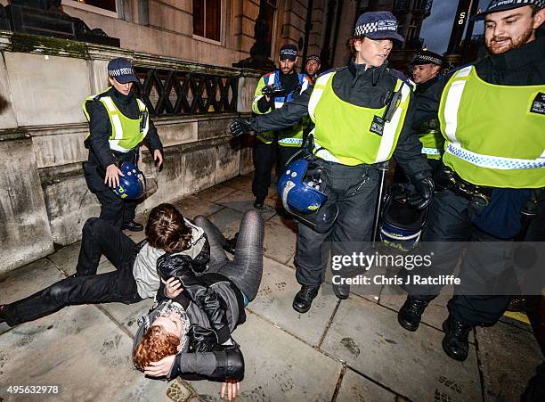 Protesters are pushed by police and kettled at the bottom of Pall Mall and Saint James' Street at the end of a demonstration against education cuts...