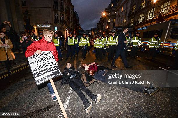 Protesters are pushed by police and kettled at the bottom of Pall Mall and Saint James' Street at the end of a demonstration against education cuts...