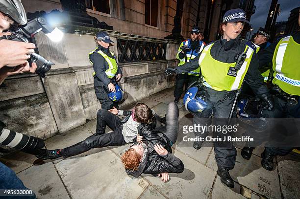 Protesters are pushed by police and kettled at the bottom of Pall Mall and Saint James' Street at the end of a demonstration against education cuts...