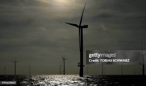 Wind turbines of the German offshore wind farm "Amrum Bank West" owned by German energy company E.ON are seen near the Heligoland archipelago on the...