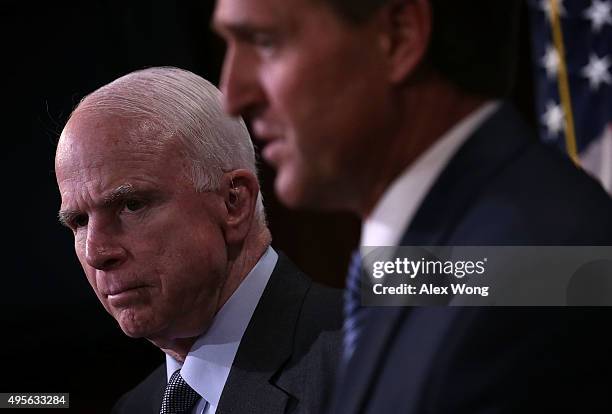 Sen. John McCain and Sen. Jeff Flake speak to members of the media during a news conference November 4, 2015 on Capitol Hill in Washington, DC. The...