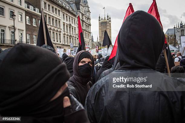 Protestors march along Whitehall during a protest against education cuts and tuition fees on November 4, 2015 in London, England. University students...