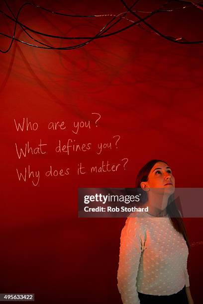 Woman looks at 'Tay Sachs 12', an installation by Tom Piper, part of the 'Blood' exhibition at Jewish Museum London on November 4, 2015 in London,...