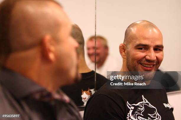 Chuck Liddell chats with Glover Teixeira before his bout against Jon Jones during the UFC 172 event at the Baltimore Arena on April 26, 2014 in...