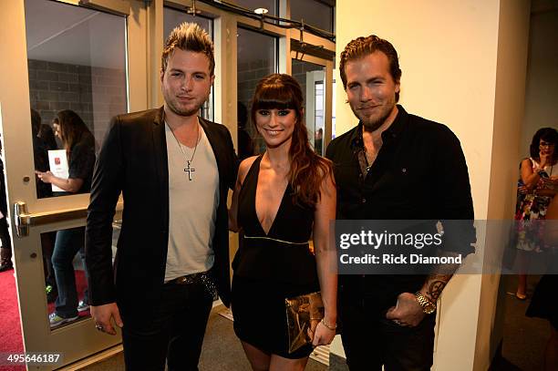 Mike Gossin, Rachel Reinert, and Tom Gossin of the band Gloriana attend the 2014 CMT Music Awards at Bridgestone Arena on June 4, 2014 in Nashville,...