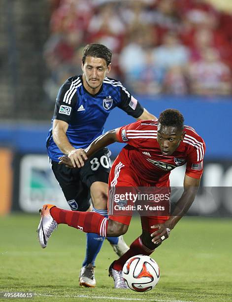 Fabian Castillo of FC Dallas works to regain control of the ball after a bump Jean-Baptiste Pierazzi of San Jose Earthquakes at Toyota Stadium on May...