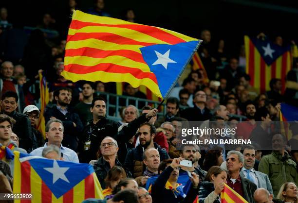 Barcelona fan waves an "estelada" during the UEFA Champions League group E football match FC Barcelona vs FC BATE Borisov at the Camp Nou stadium in...