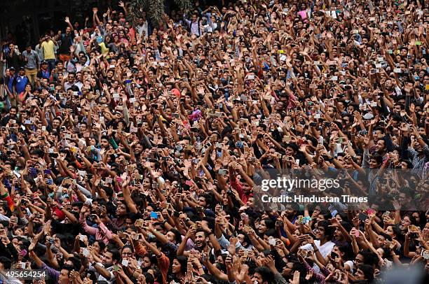 Huge crowd of young fans capturing the images of bollywood actors Salman Khan and Sonam Kapoor on their visit to the Amity University to promote...