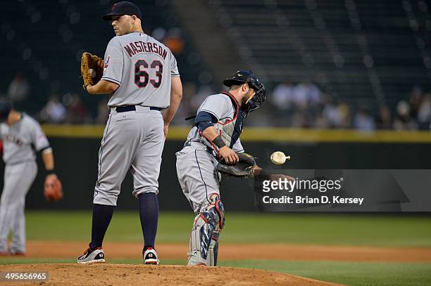 Starting pitcher Justin Masterson of the Cleveland Indians stands on the mound as catcher Yan Gomes flips the rosin bag during the first inning...