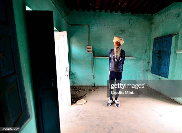Year-old marathon runner Fauja Singh at his house on March 20, 2014 in Jalandhar, India. Fauja Singh is an Indian centenarian marathon runner of...