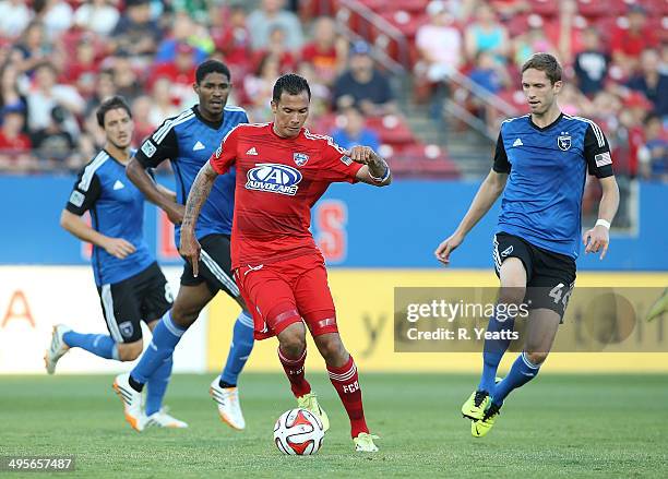 Blas Perez of FC Dallas handles the ball against Clarence Goodson of San Jose Earthquakes at Toyota Stadium on May 31, 2014 in Frisco, Texas.