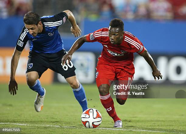 Fabian Castillo of FC Dallas works to regain control of the ball after a bump Jean-Baptiste Pierazzi of San Jose Earthquakes at Toyota Stadium on May...