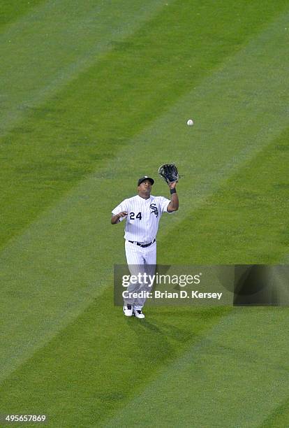 Left fielder Dayan Viciedo of the Chicago White Sox catches a fly ball during the eighth inning against the Cleveland Indians at U.S. Cellular Field...