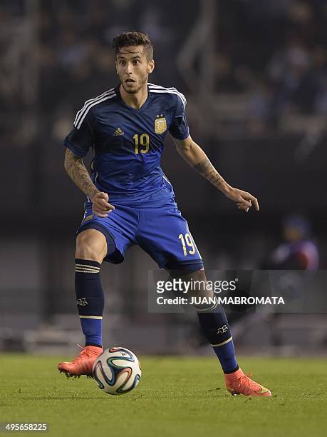 Argentina's midfielder Ricky Alvarez controls the ball during a friendly football match against Trinidad and Tobago at the Monumental stadium in...