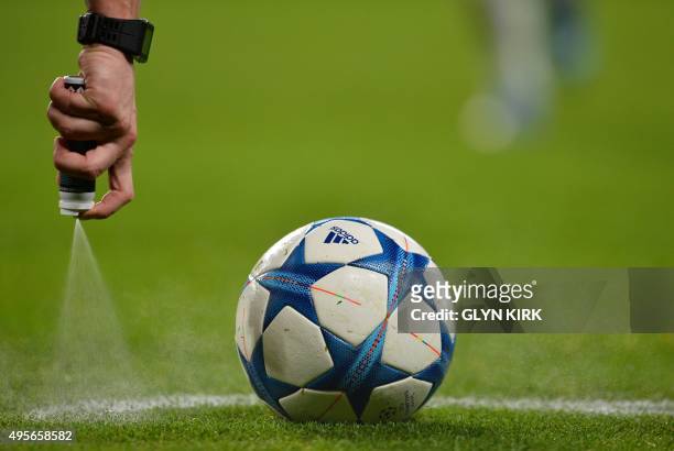 Czech referee Pavel Kralovev sprays the free kick line during a UEFA Chamions league group stage football match between Chelsea and Dynamo Kiev at...